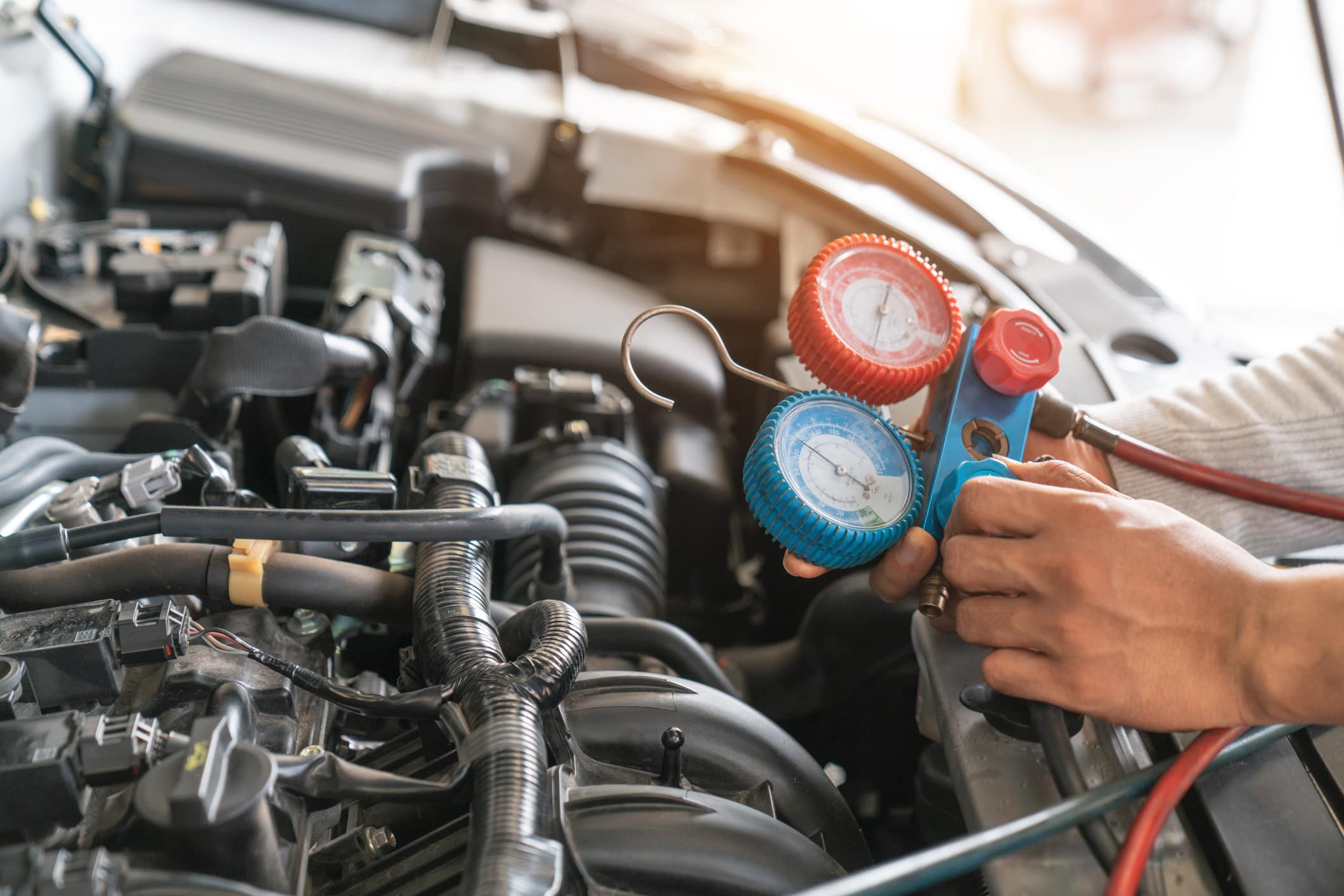 monitor tool on car engine ready to check and fixed car air conditioner system in car garage